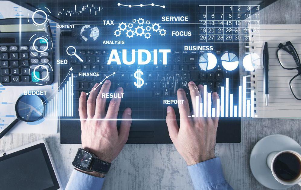AI audit dashboard with hands on keyboard analyzing data
