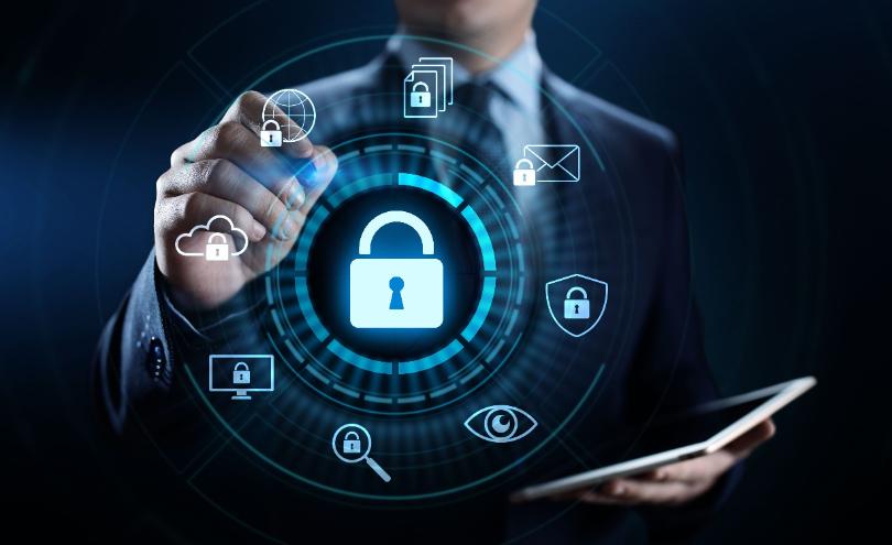 Businessman interacting with cybersecurity icons representing digital protection.